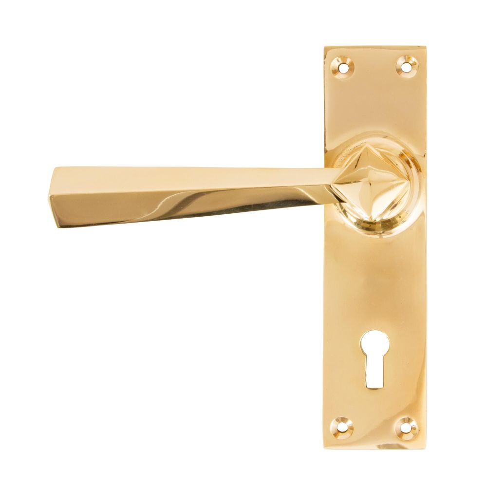 This is an image showing From The Anvil - Polished Brass Straight Lever Lock Set available from trade door handles, quick delivery and discounted prices