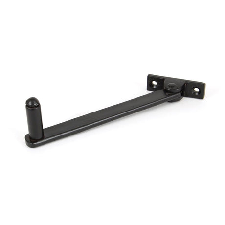 This is an image showing From The Anvil - Black 6" Roller Arm Stay available from trade door handles, quick delivery and discounted prices