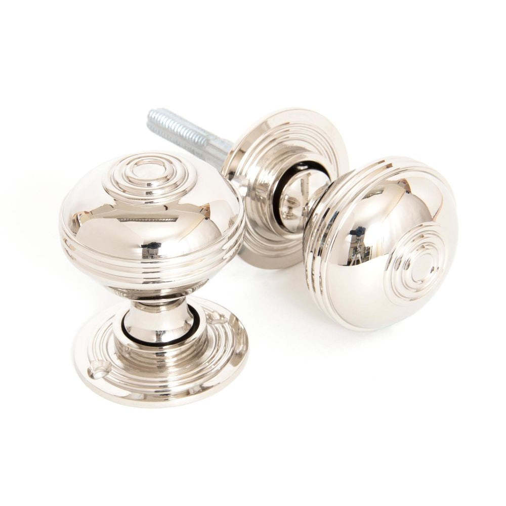 This is an image showing From The Anvil - Polished Nickel 50mm Prestbury Mortice/Rim Knob Set available from trade door handles, quick delivery and discounted prices