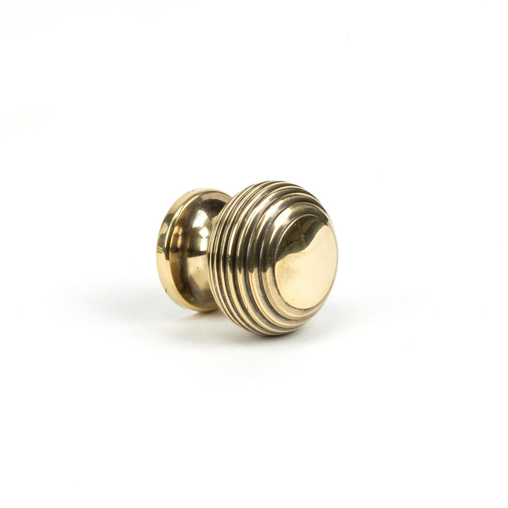 This is an image showing From The Anvil - Aged Brass Beehive Cabinet Knob 30mm available from trade door handles, quick delivery and discounted prices