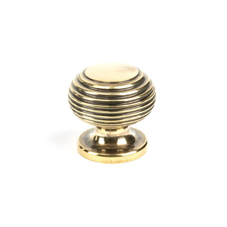 This is an image showing From The Anvil - Aged Brass Beehive Cabinet Knob 30mm available from trade door handles, quick delivery and discounted prices