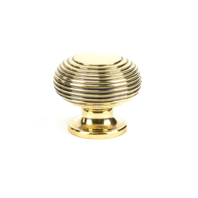 This is an image showing From The Anvil - Aged Brass Beehive Cabinet Knob 40mm available from trade door handles, quick delivery and discounted prices