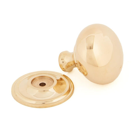 This is an image showing From The Anvil - Polished Brass Mushroom Cabinet Knob 38mm available from trade door handles, quick delivery and discounted prices