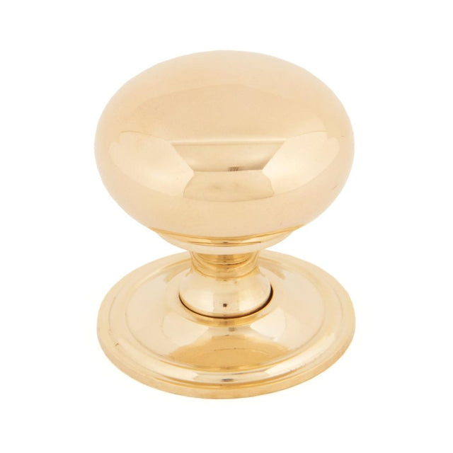 This is an image showing From The Anvil - Polished Brass Mushroom Cabinet Knob 38mm available from trade door handles, quick delivery and discounted prices