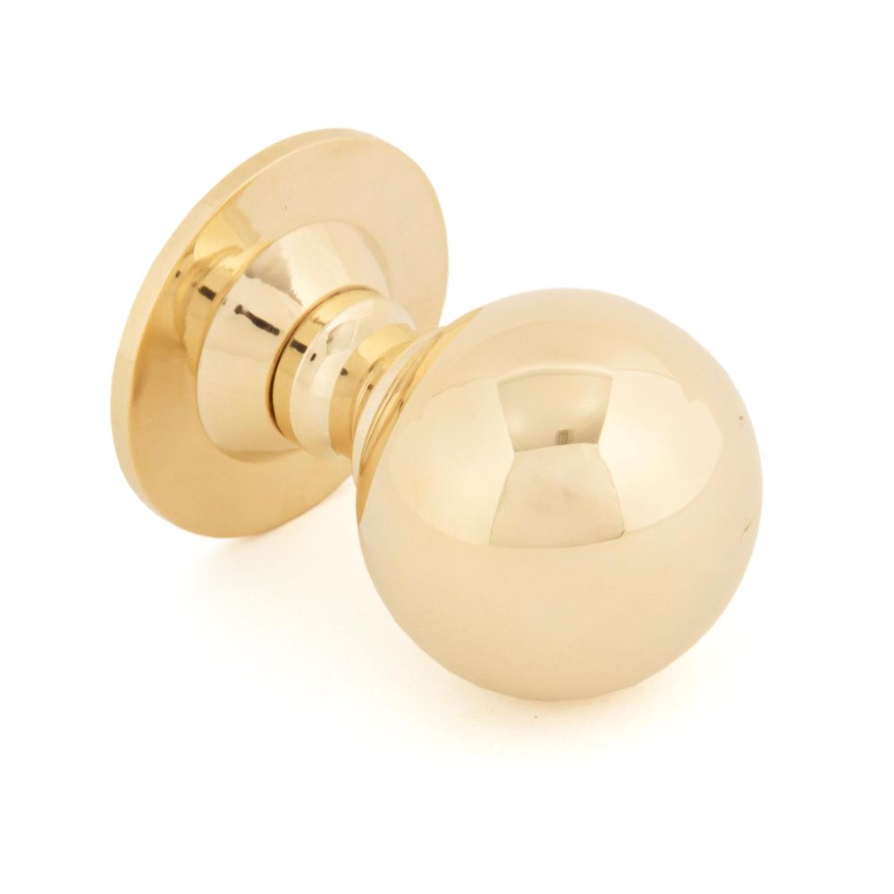 This is an image showing From The Anvil - Polished Brass Ball Cabinet Knob 39mm available from trade door handles, quick delivery and discounted prices