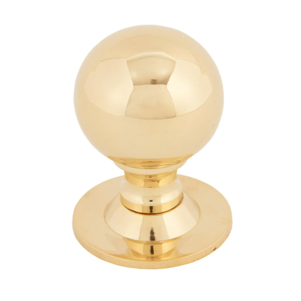 This is an image showing From The Anvil - Polished Brass Ball Cabinet Knob 39mm available from trade door handles, quick delivery and discounted prices