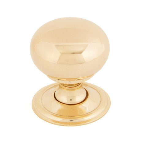 This is an image showing From The Anvil - Polished Brass Mushroom Cabinet Knob 32mm available from trade door handles, quick delivery and discounted prices