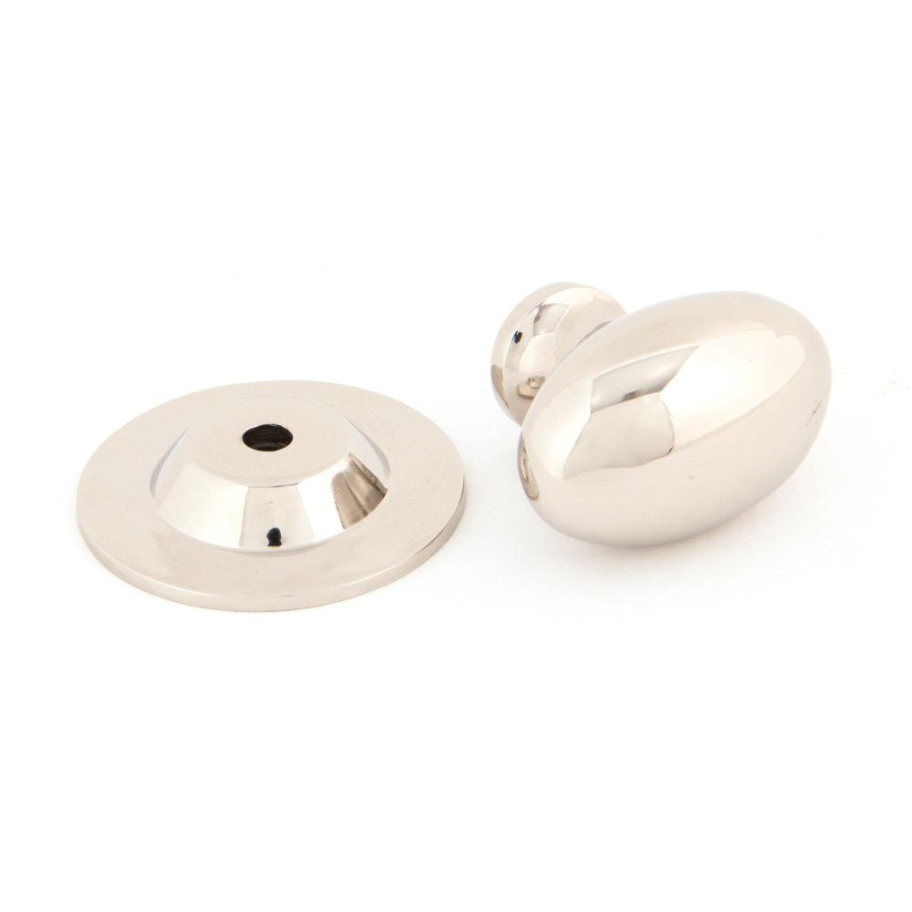 This is an image showing From The Anvil - Polished Nickel Oval Cabinet Knob 33mm available from trade door handles, quick delivery and discounted prices