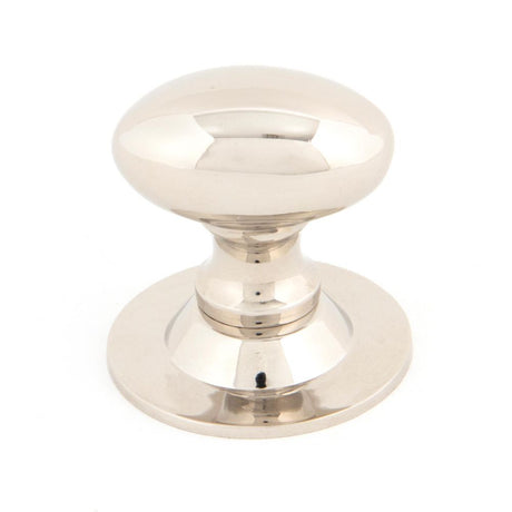 This is an image showing From The Anvil - Polished Nickel Oval Cabinet Knob 33mm available from trade door handles, quick delivery and discounted prices