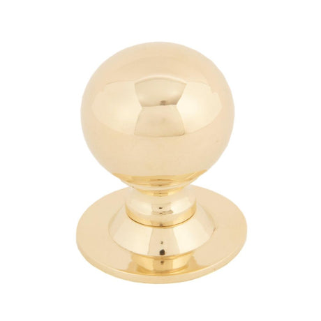 This is an image showing From The Anvil - Polished Brass Ball Cabinet Knob 31mm available from trade door handles, quick delivery and discounted prices