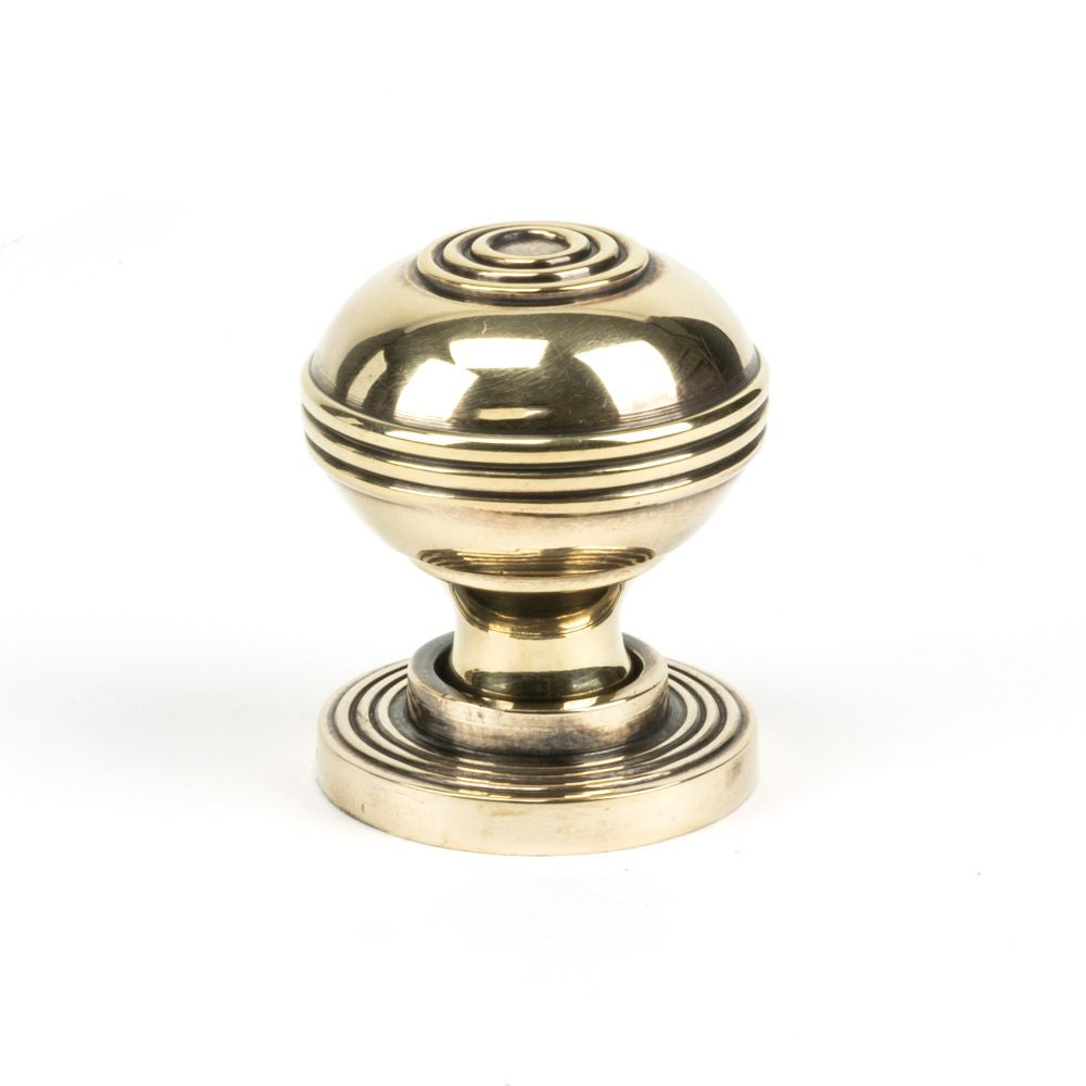 This is an image showing From The Anvil - Aged Brass Prestbury Cabinet Knob 32mm available from trade door handles, quick delivery and discounted prices