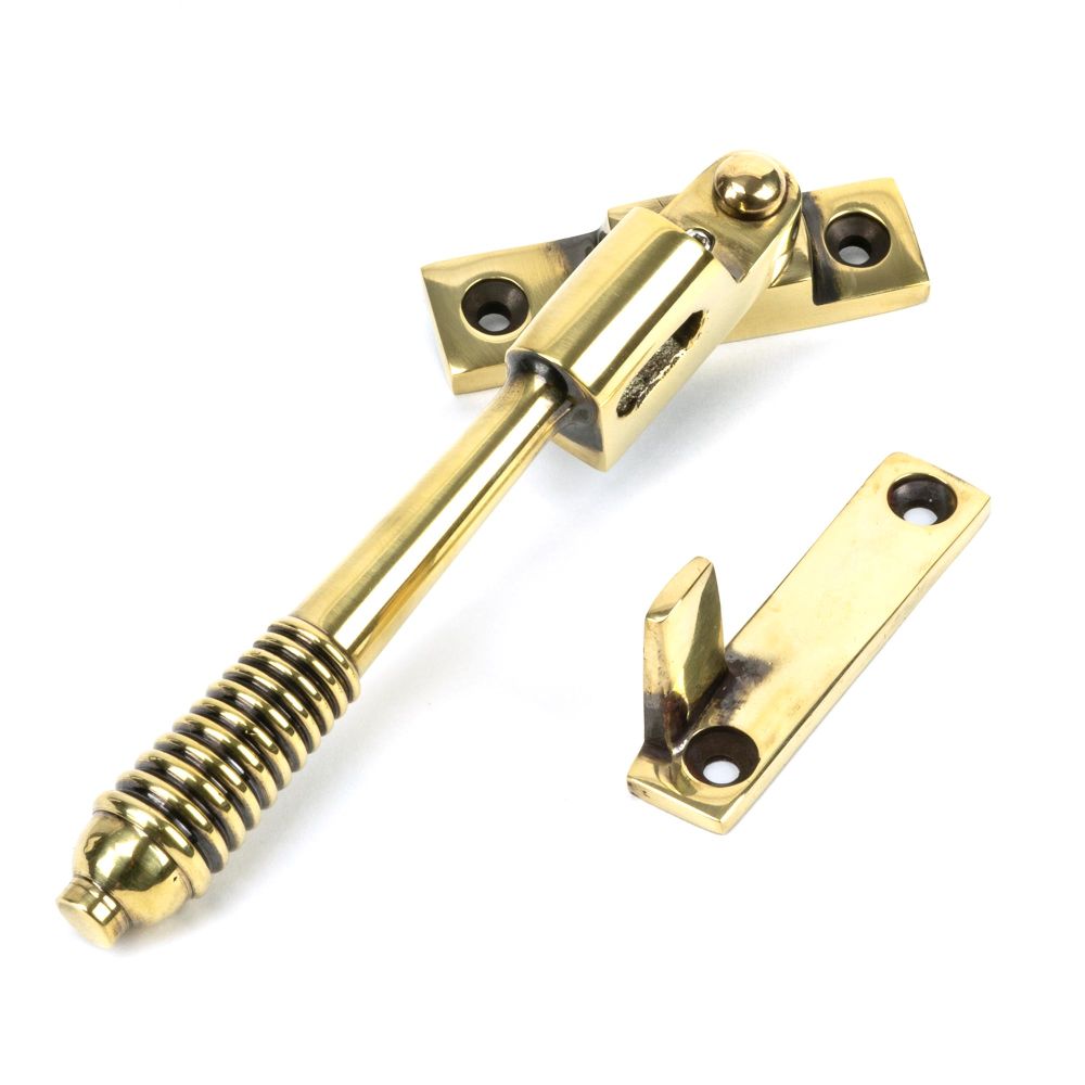 This is an image showing From The Anvil - Aged Brass Night-Vent Locking Reeded Fastener available from trade door handles, quick delivery and discounted prices