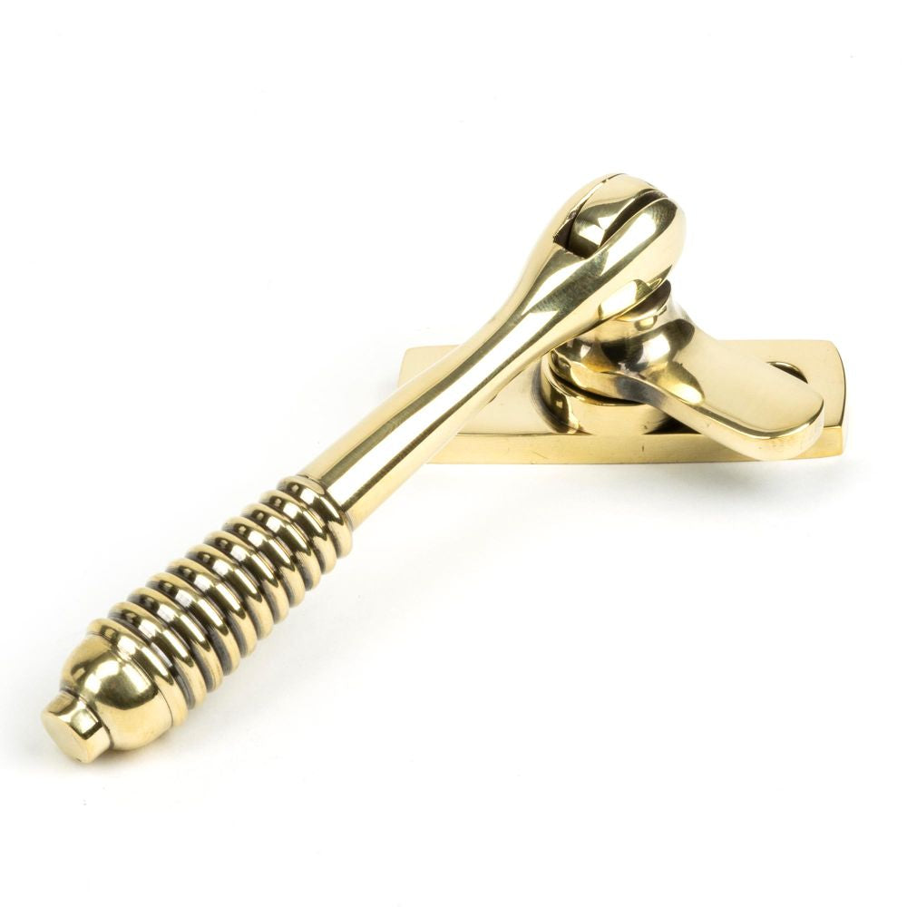 This is an image showing From The Anvil - Aged Brass Locking Reeded Fastener available from trade door handles, quick delivery and discounted prices