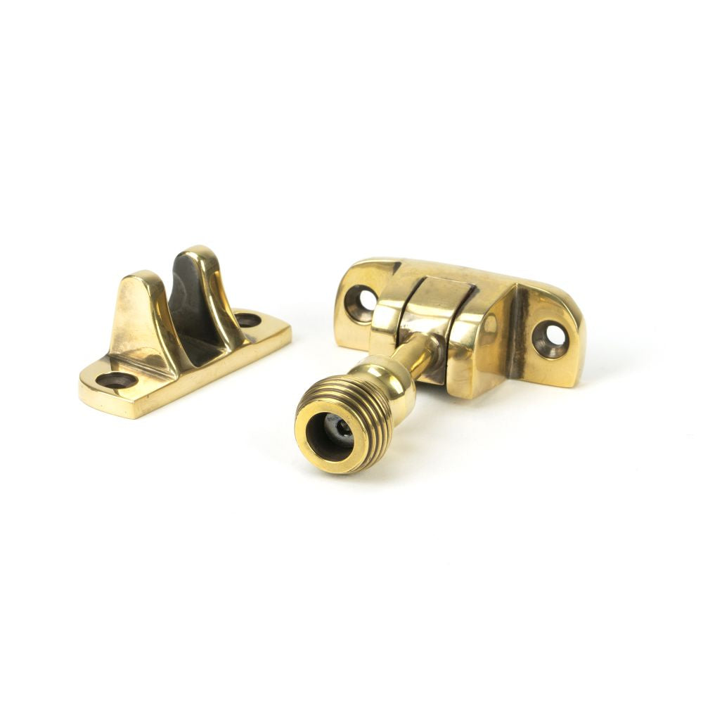 This is an image showing From The Anvil - Aged Brass Beehive Brighton Fastener (Radiused) available from trade door handles, quick delivery and discounted prices