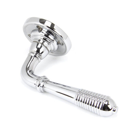 This is an image showing From The Anvil - Polished Chrome Reeded Lever on Rose Set available from trade door handles, quick delivery and discounted prices