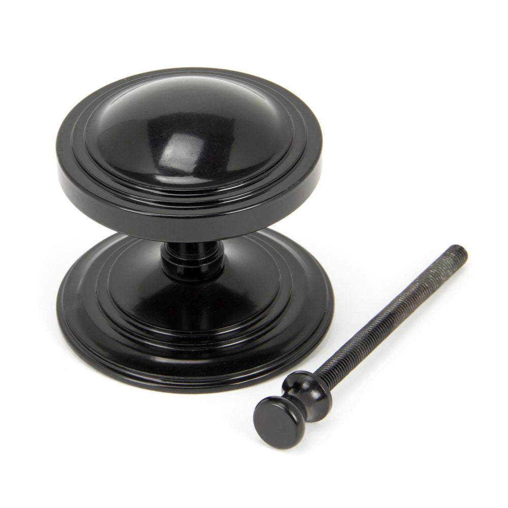 This is an image showing From The Anvil - Black Art Deco Centre Door Knob available from trade door handles, quick delivery and discounted prices