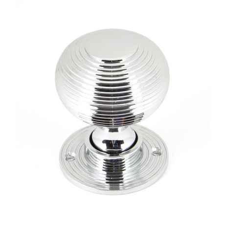 This is an image showing From The Anvil - Polished Chrome Heavy Beehive Mortice/Rim Knob Set available from trade door handles, quick delivery and discounted prices