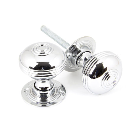 This is an image showing From The Anvil - Polished Chrome 50mm Prestbury Mortice/Rim Knob Set available from trade door handles, quick delivery and discounted prices