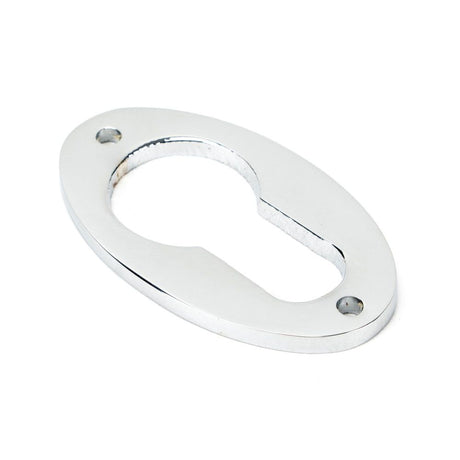 This is an image showing From The Anvil - Polished Chrome Oval Euro Escutcheon available from trade door handles, quick delivery and discounted prices