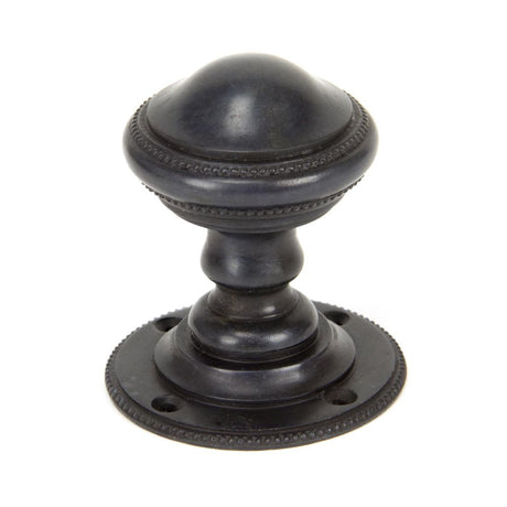 This is an image showing From The Anvil - Aged Bronze Brockworth Mortice Knob Set available from trade door handles, quick delivery and discounted prices