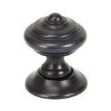 This is an image showing From The Anvil - Aged Bronze Elmore Concealed Mortice Knob Set available from trade door handles, quick delivery and discounted prices