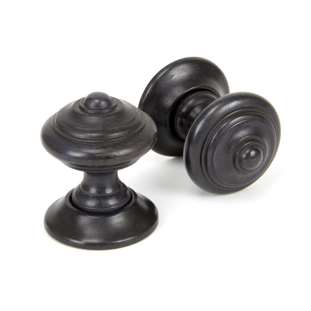 This is an image showing From The Anvil - Aged Bronze Elmore Concealed Mortice Knob Set available from trade door handles, quick delivery and discounted prices