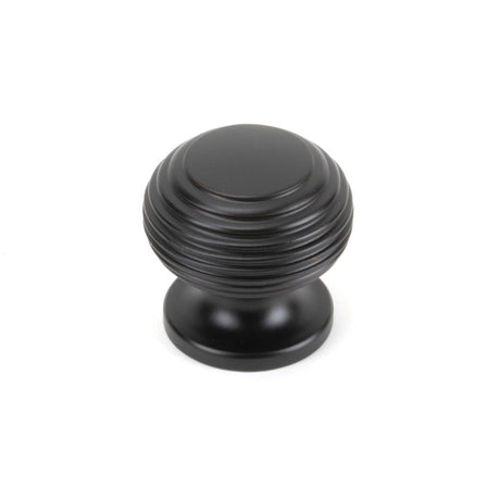 This is an image showing From The Anvil - Aged Bronze Beehive Cabinet Knob 30mm available from trade door handles, quick delivery and discounted prices