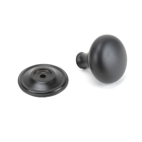 This is an image showing From The Anvil - Aged Bronze Mushroom Cabinet Knob 38mm available from trade door handles, quick delivery and discounted prices