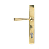 This is an image showing From The Anvil - Aged Brass Avon Slimline Lever Espag. Lock Set available from trade door handles, quick delivery and discounted prices