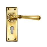 This is an image showing From The Anvil - Aged Brass Newbury Lever Euro Lock Set available from trade door handles, quick delivery and discounted prices