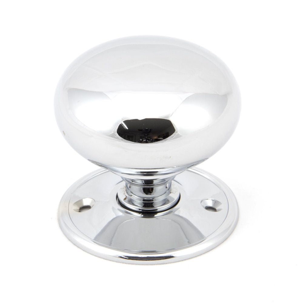 This is an image showing From The Anvil - Polished Chrome 57mm Mushroom Mortice/Rim Knob Set available from trade door handles, quick delivery and discounted prices