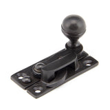This is an image showing From The Anvil - Aged Bronze Prestbury Sash Hook Fastener available from trade door handles, quick delivery and discounted prices