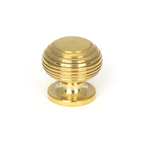 This is an image showing From The Anvil - Polished Brass Beehive Cabinet Knob 30mm available from trade door handles, quick delivery and discounted prices