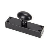 This is an image showing From The Anvil - Black knob for Cremone Bolt available from trade door handles, quick delivery and discounted prices