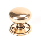 This is an image showing From The Anvil - Polished Bronze Mushroom Mortice/Rim Knob Set available from trade door handles, quick delivery and discounted prices