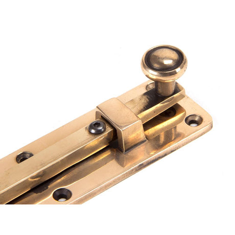 This is an image showing From The Anvil - Polished Bronze 6" Universal Bolt available from trade door handles, quick delivery and discounted prices