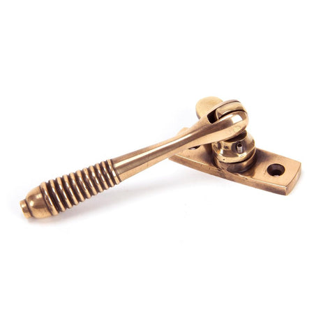 This is an image showing From The Anvil - Polished Bronze Locking Reeded Fastener available from trade door handles, quick delivery and discounted prices