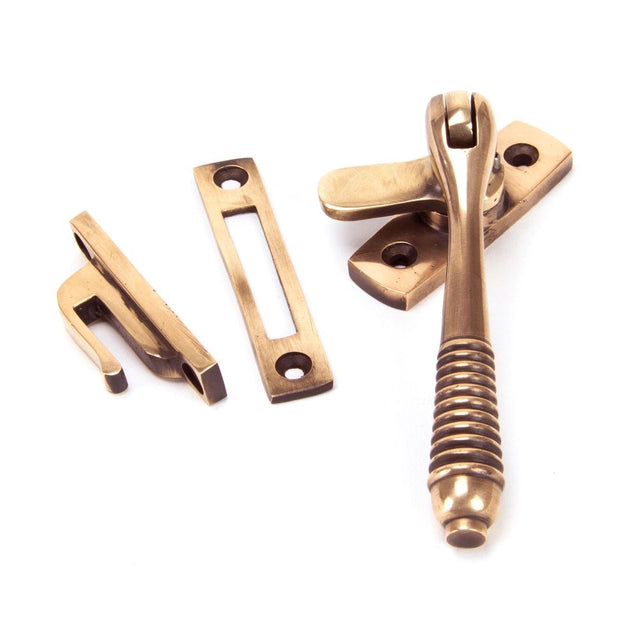 This is an image showing From The Anvil - Polished Bronze Locking Reeded Fastener available from trade door handles, quick delivery and discounted prices