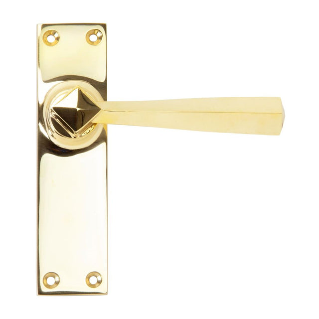 This is an image showing From The Anvil - Polished Brass Straight Lever Latch Set available from trade door handles, quick delivery and discounted prices