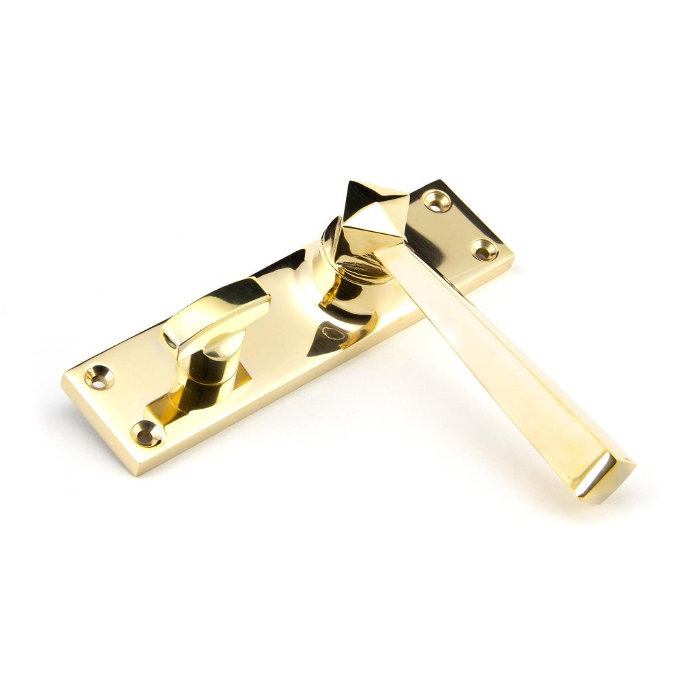 This is an image showing From The Anvil - Polished Brass Straight Lever Bathroom Set available from trade door handles, quick delivery and discounted prices