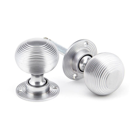 This is an image showing From The Anvil - Satin Chrome Heavy Beehive Mortice/Rim Knob Set available from trade door handles, quick delivery and discounted prices