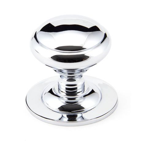 This is an image showing From The Anvil - Polished Chrome Round Centre Door Knob available from trade door handles, quick delivery and discounted prices