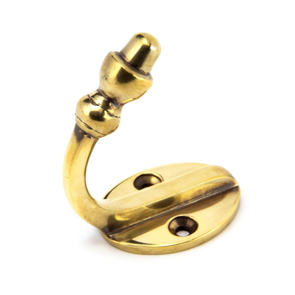 This is an image showing From The Anvil - Aged Brass Coat Hook available from trade door handles, quick delivery and discounted prices