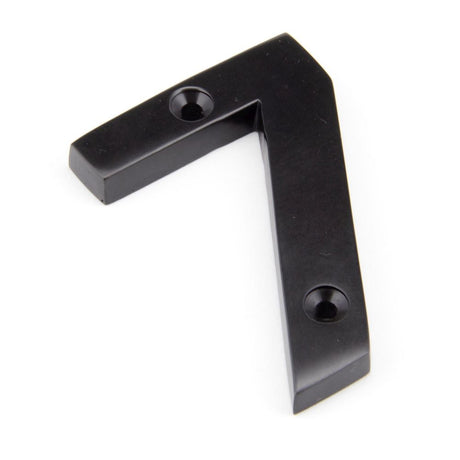 This is an image showing From The Anvil - Aged Bronze Numeral 7 available from trade door handles, quick delivery and discounted prices