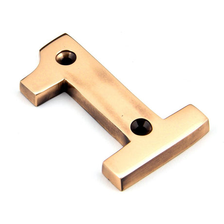 This is an image showing From The Anvil - Polished Bronze Numeral 1 available from trade door handles, quick delivery and discounted prices