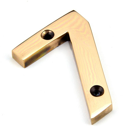 This is an image showing From The Anvil - Polished Bronze Numeral 7 available from trade door handles, quick delivery and discounted prices