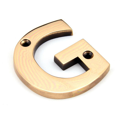 This is an image showing From The Anvil - Polished Bronze Letter G available from trade door handles, quick delivery and discounted prices