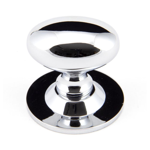 This is an image showing From The Anvil - Polished Chrome Oval Cabinet Knob 40mm available from trade door handles, quick delivery and discounted prices