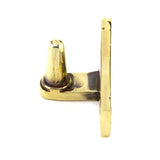 This is an image showing From The Anvil - Aged Brass Cranked Stay Pin available from trade door handles, quick delivery and discounted prices