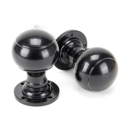 This is an image showing From The Anvil - Black Regency Mortice/Rim Knob Set available from trade door handles, quick delivery and discounted prices